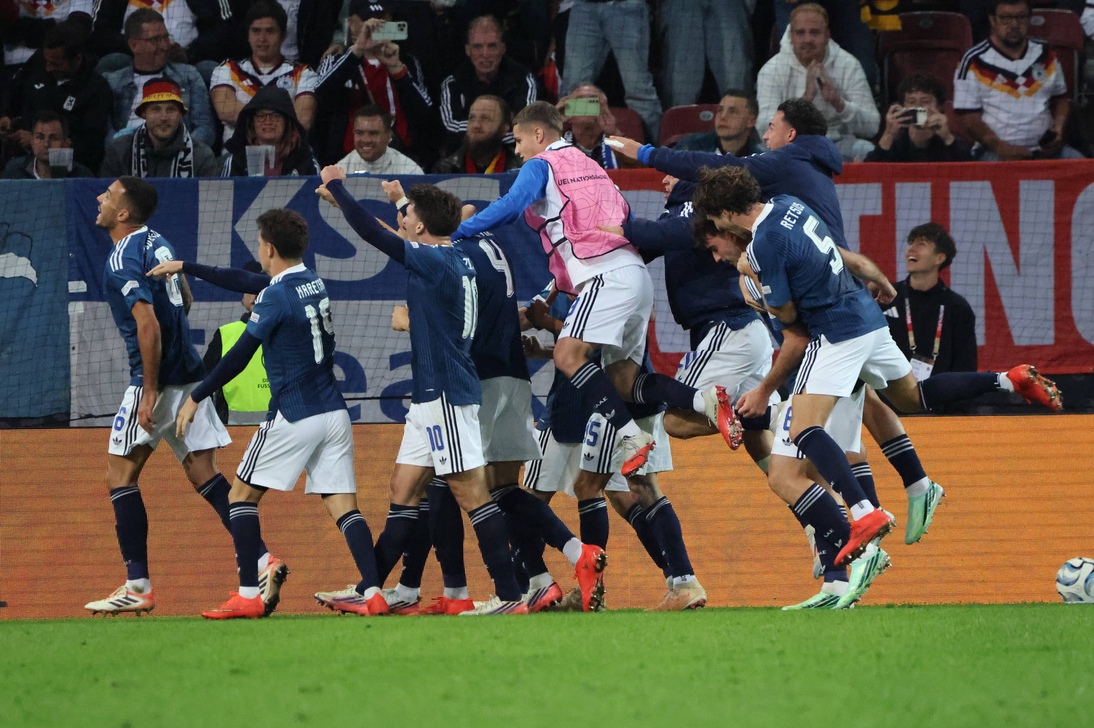 Greece celebrate a goal against Germany