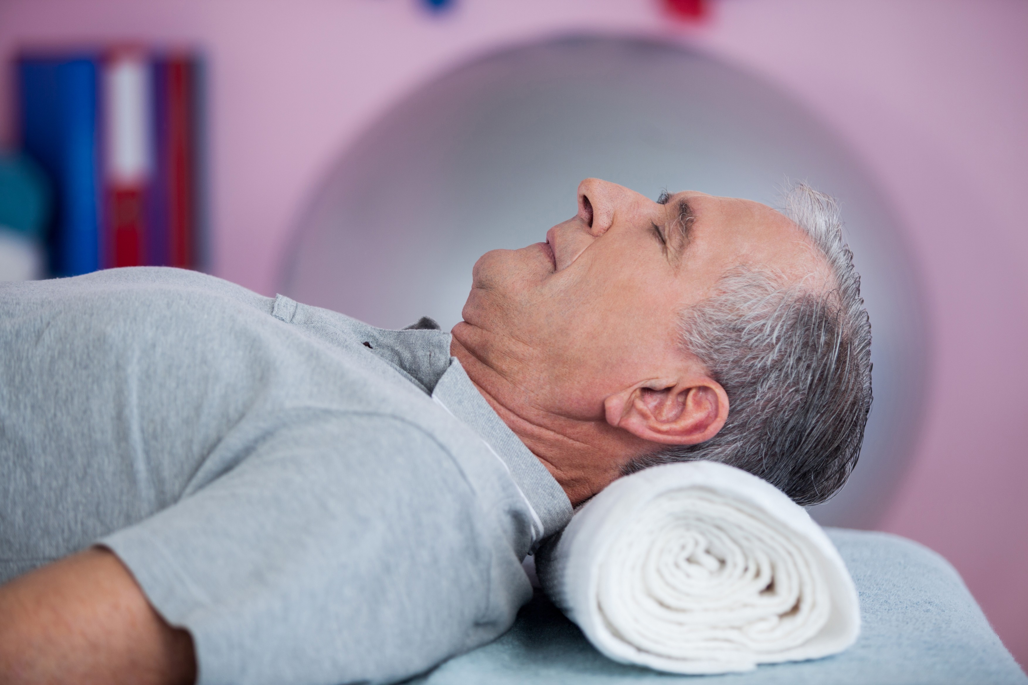Senior man lying on a massage bed in clinic,Image: 309170212,
