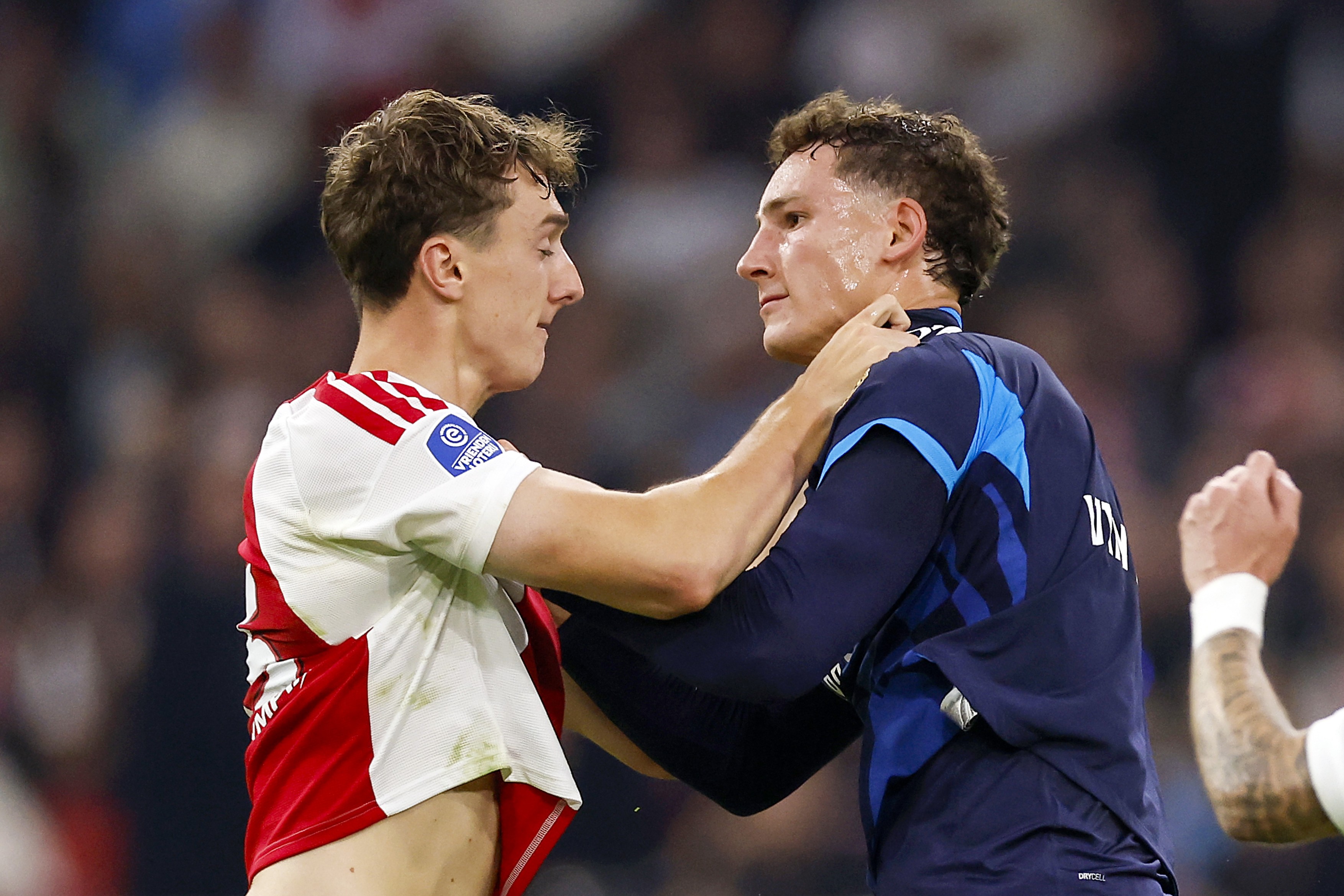 Youri Baas of AFC Ajax grabs Ruben van Bommel of PSV Eindhoven