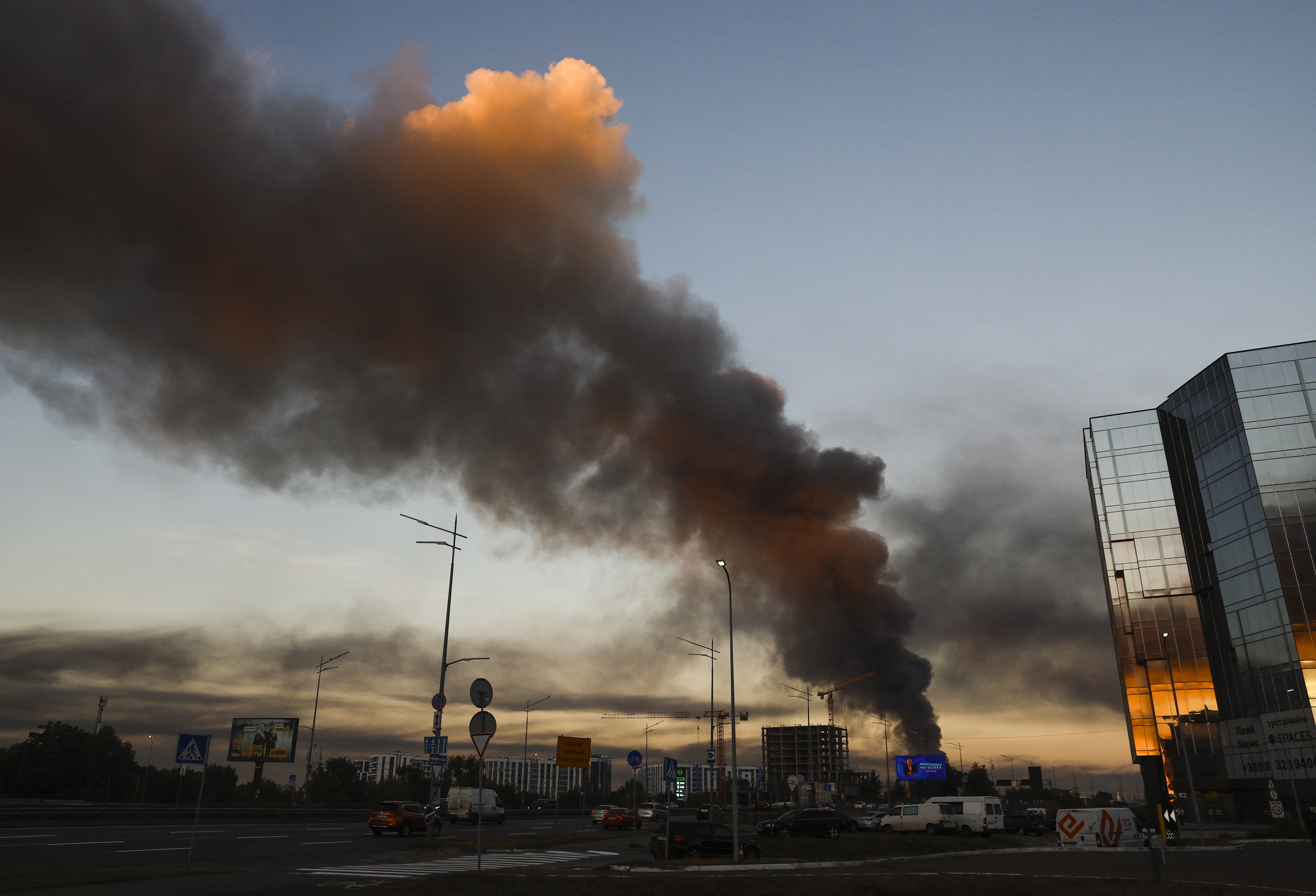 epa13221498 Smoke rises over a residential area after an overnight Russian co