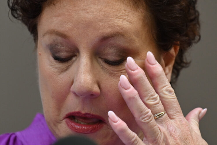 Kathleen Folbigg wipes her eye as she speaks to the media outside the New South Wales Court of Criminal Appeal in Sydney, Australia, 14 December 2023. Folbigg was jailed in 2003 and spent twenty years in prison after she was wrongly found guilty on three counts of murder and one of manslaughter following the deaths of her four children. Folbigg was pardoned and freed in June 2023 and has now had her convictions formally quashed. EPA-EFE/DAN HIMBRECHTS AUSTRALIA AND NEW ZEALAND OUT